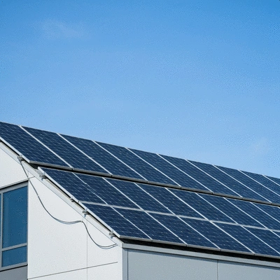 Industrial solar panels on a rooftop, showing optimal angle and orientation for maximum sun exposure